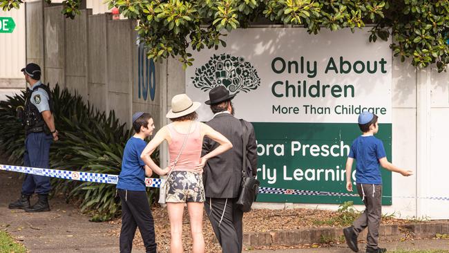 Members of the local Jewish community in Maroubra arrive with their children at the childcare centre which was firebombed in an anti-Semitic attack.