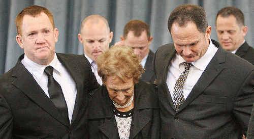 Sandra Walters is flanked by her sons at yesterday’s funeral for Kevin Walters Senior. . Picture: Rob Williams, The Queensland Times