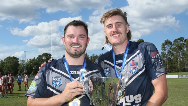 Newcastle skipper Chad O’Donnell and man of the match Cameron Anderson celebrate with the trophy. Picture: Sue Graham