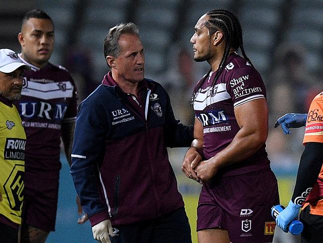 Martin Taupau of the Sea Eagles (right) leaves the field with a thumb injury during the Round 5 NRL match between the Manly Sea Eagles and the Brisbane Broncos. Picture: AAP Image/Dan Himbrechts