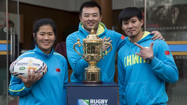 Sun Ting Ting, Jack Lau and Liu Guan Jun during the Rugby World Cup trophy tour.