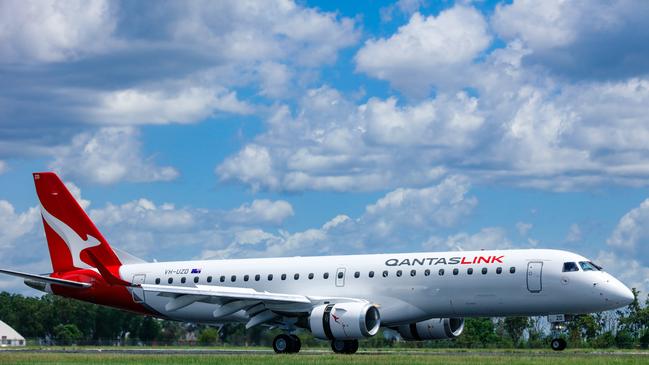 An Embraer E190 in Qantas Livery arrives in Darwin. Picture: Glenn Campbell