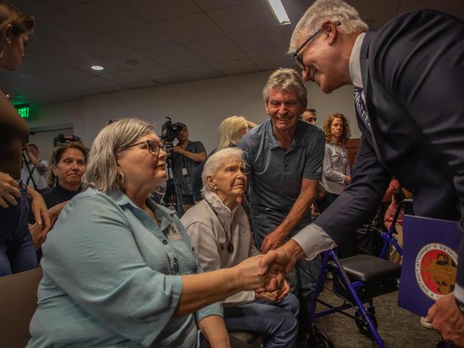 George Gascon shakes hands with Diane Hernandez (niece of Kitty Menendez) watched by Joan VanderMolen (sister of Kitty Menendez) and Arnold VanderMolen (nephew of Kitty Menendez). Picture: Getty Images via AFP