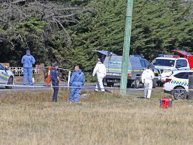 Tasmanian Police at the scene of the fatal shooting. Picture: Zak Simmonds