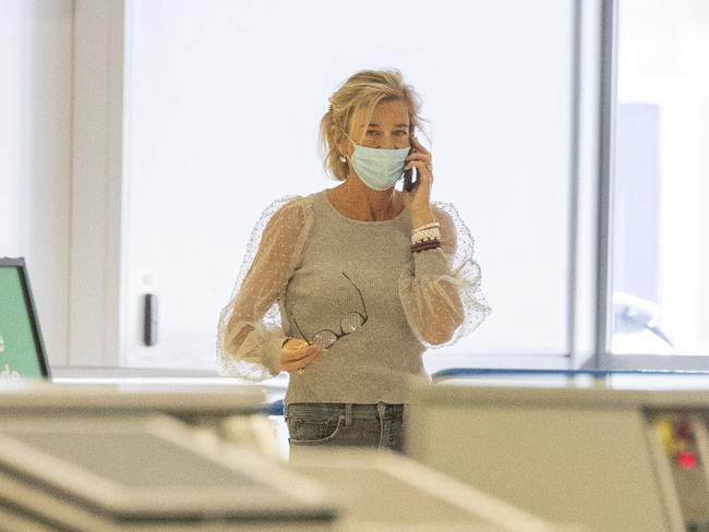 Katie Hopkins has since been spotted at Sydney Airport as she prepares to fly out of the country. Unlike her previous expeditions, she is now wearing the legally required mask. Picture: Diimex