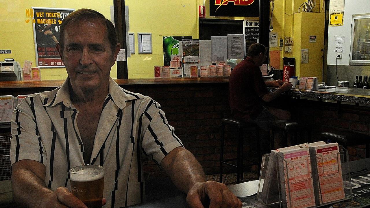 Owner Leigh Wanless holds a beer at the Westside Tavern