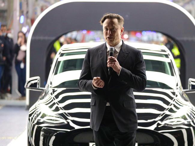 GRUENHEIDE, GERMANY - MARCH 22: Tesla CEO Elon Musk speaks during the official opening of the new Tesla electric car manufacturing plant on March 22, 2022 near Gruenheide, Germany. The new plant, officially called the Gigafactory Berlin-Brandenburg, is producing the Model Y as well as electric car batteries. (Photo by Christian Marquardt - Pool/Getty Images)