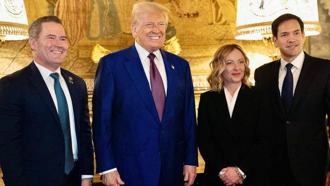 Giorgia Meloni and Donald Trump with senator Marco Rubio, right, and US incoming national security adviser Mike Waltz, left, at Mar-a-Lago on Saturday. Picture: AFP