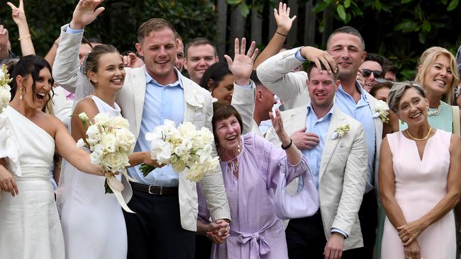 Pastel-clad guests included grandmother Valerie, seen holding Tom’s hand. Picture: Matrix