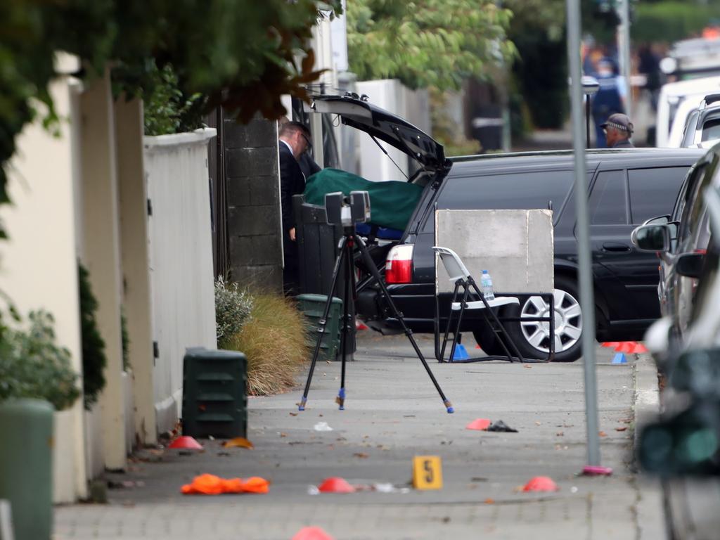 Police have begun the difficult task of removing the bodies from the mosque. Picture: Gary Ramage