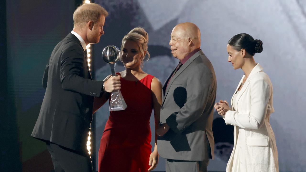 Prince Harry, Duke of Sussex accepts the Pat Tillman Award onstage from Kirstie Ennis, Israel Del Toro and Elizabeth Marks during the 2024 ESPY Awards. Picture: Frazer Harrison/Getty Images