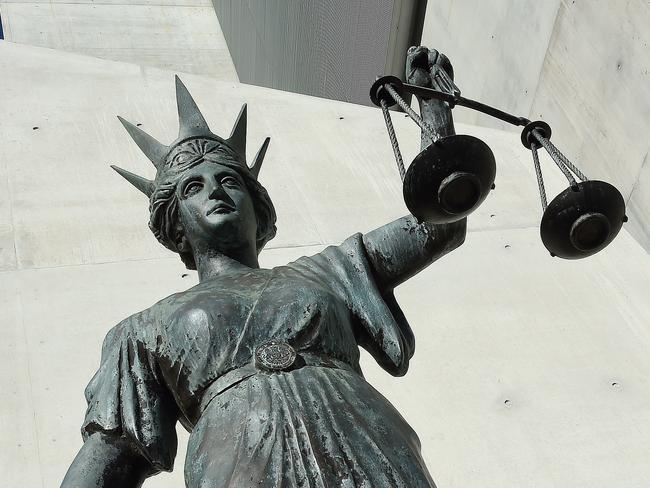 A statue of Themis, the Greek God of Justice stands outside the Supreme Court in Brisbane, Thursday, Oct. 20, 2016. (AAP Image/Dave Hunt) NO ARCHIVING