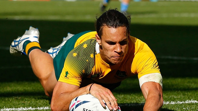 Matt Toomua scores against Uruguay during the 2015 World Cup. (Photo by Stu Forster/Getty Images)