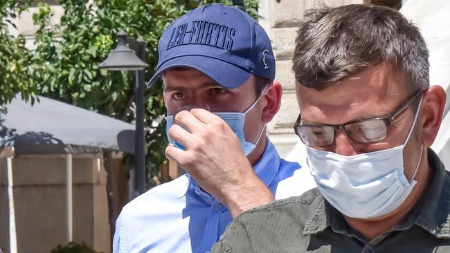England's Harry Maguire, left, eaves a courthouse on the Greek island of Syros, the administrative hub of the Cycladic island group that includes Mykonos, on August 22. Picture: Eurokinissi/AFP