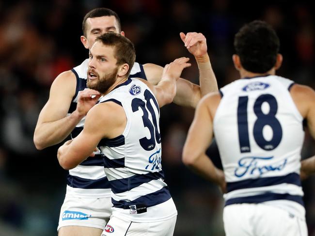 Tom Atkins celebrates and early goal on Friday. Picture: Dylan Burns/AFL Photos via Getty Images