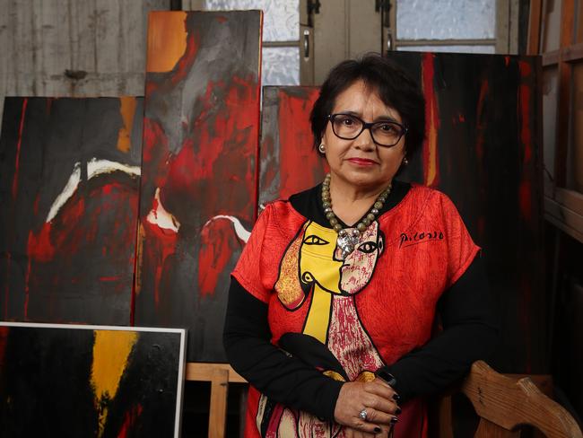 Artist Susana Enriquez, pictured with some recent work, has struggled with her mental health since the bushfires and COVID-19. Picture: David Swift