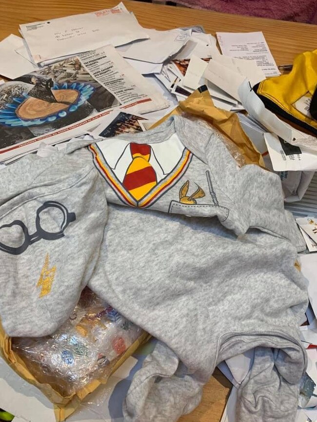 Some of the mail and contents of parcels. including a Harry Potter sweatshirt, dumped on Clontarf Beach. Picture: Felecia Tappenden