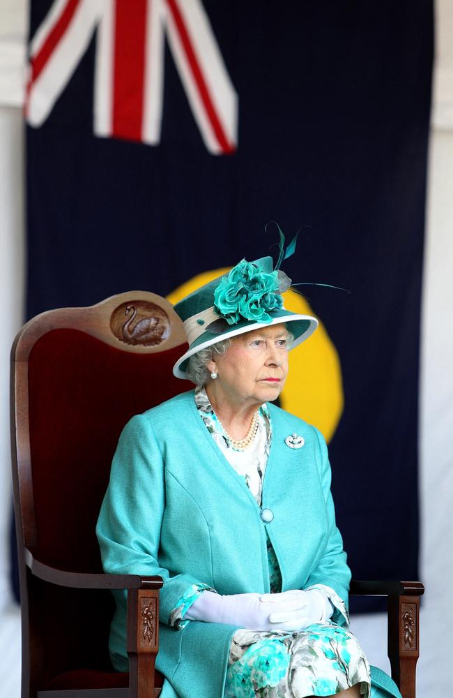 2011: Britain's Queen Elizabeth II sits on the stage overlooking the crowd during a garden party at Government House in Perth, Western Australia, on October 27, 2011. Picture: Lincoln Baker/AFP