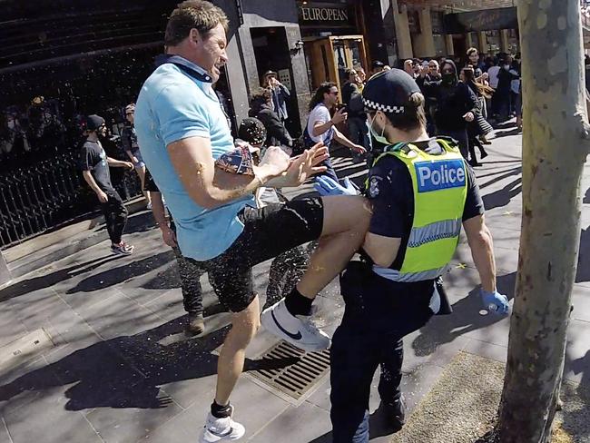 A protester clashes with police during the ugly protest. Picture: Jason Edwards