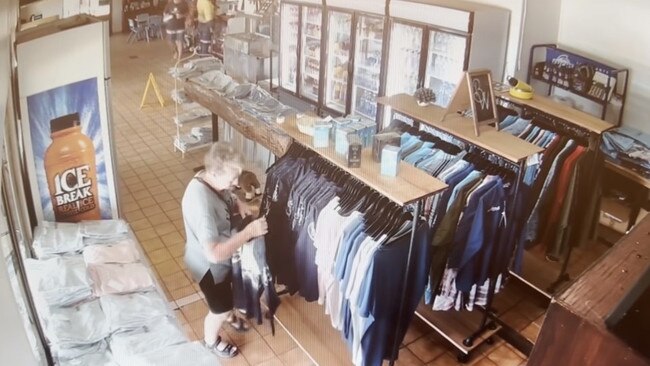 A woman has been caught on CCTV appearing to take shirts from a Queensland roadhouse. Picture: Supplied