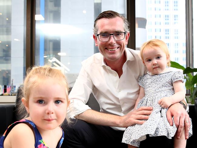 NSW Treasurer Dominic Perrottet pictured getting ready to deliver the state budget next Tuesday with his kids Harriet 3 and Beatrice 1 in his city office. Picture: Toby Zerna