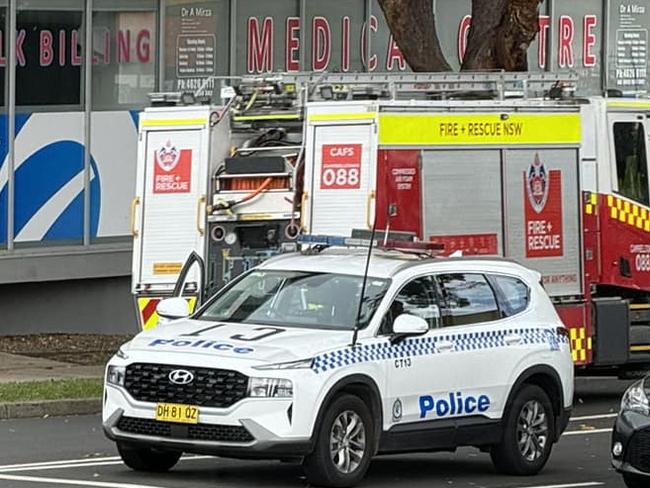 Firefighters and police responding to a fire at an abandoned shopping centre on Queen St, Campbelltown. Picture: Facebook