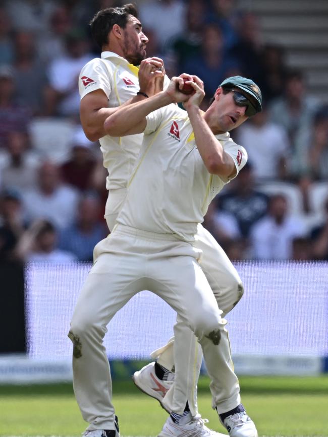 Mitchell Starc and Pat Cummins combine awkwardly to dismiss Harry Brook. Picture: AFP