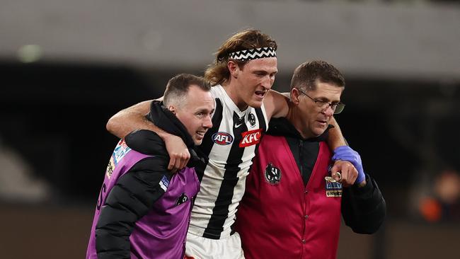 Nathan Murphy is helped from the field on Saturday. Picture: Michael Klein.