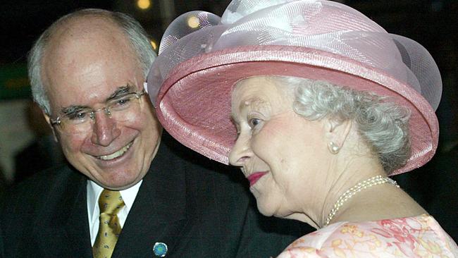 Queen Elizabeth II chats with then Prime Minister John Howard before the opening of the Commonwealth summit. Picture: AFP