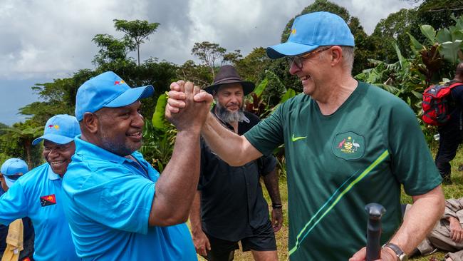 Australia's Prime Minister Anthony Albanese and Papua New Guinea Prime Minister James Marape walk along the Kokoda Track at Kokoda Village in Papua New Guinea on April 24, 2024. Picture: NCA NewsWire via the Australian Prime Ministers Office