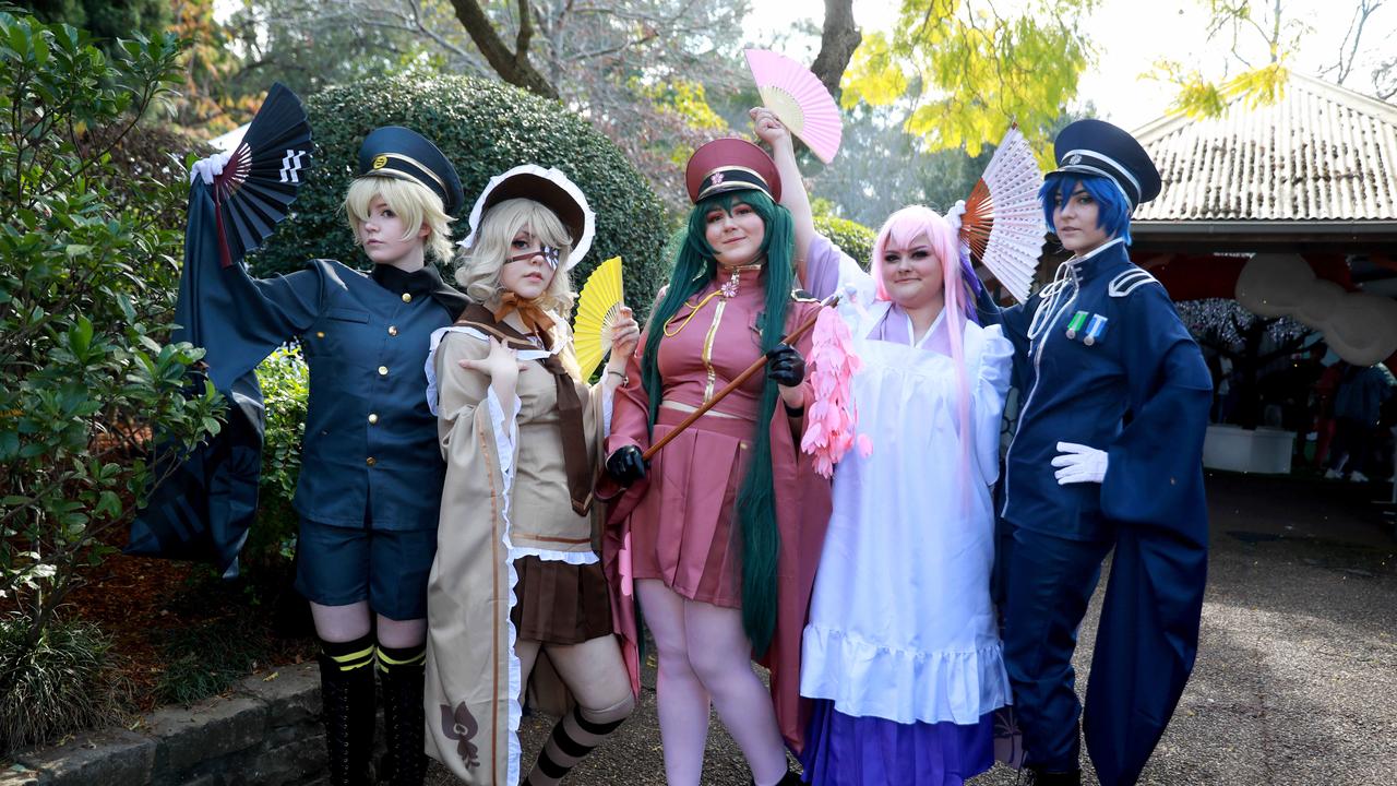 (L-R) Mya Irving, Ash Randell, Alana Addesso, Laila sumner and Teny Pasnin pose for photographs dressed in Cosplay at the Cherry Blossom Festival in Auburn. (AAP IMAGE / Angelo Velardo)