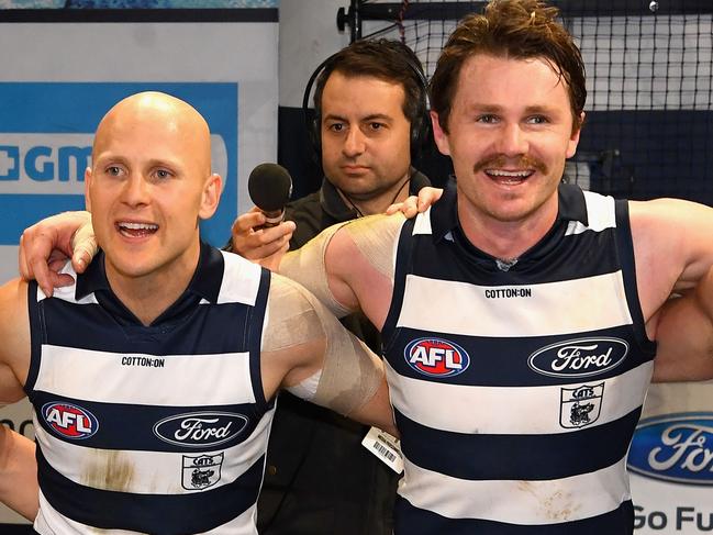 GEELONG, AUSTRALIA - JUNE 09:  Lachine Fogarty, Gary Ablett and Patrick Dangerfield of the Cats sing the song in the rooms after winning the round 12 AFL match between the Geelong Cats and the North Melbourne Kangaroos at GMHBA Stadium on June 9, 2018 in Geelong, Australia.  (Photo by Quinn Rooney/Getty Images)