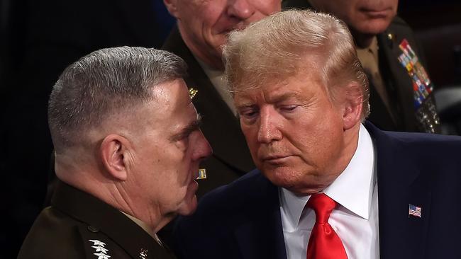 Chairman of the Joint Chiefs of Staff General Mark Milley chats with US President Donald Trump.