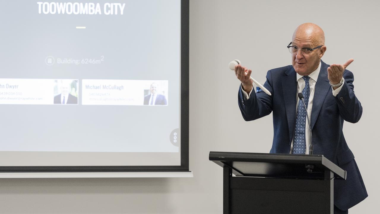 Auctioneer Phil Parker conducts the Ray White Commercial auction at Oaks of Pigotts Building in Toowoomba CBD. Picture: Kevin Farmer