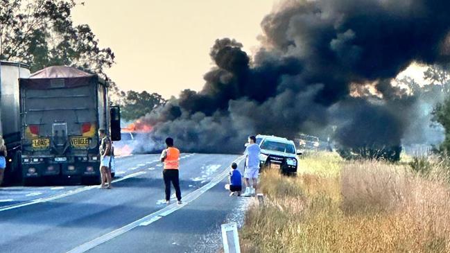 Emergency services are responding to reports of a car fully engulfed in fire and possible explosions on the Bruce Highway.