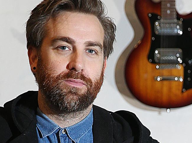 Josh Pyke in his studio with some memorabilia collected during his career.