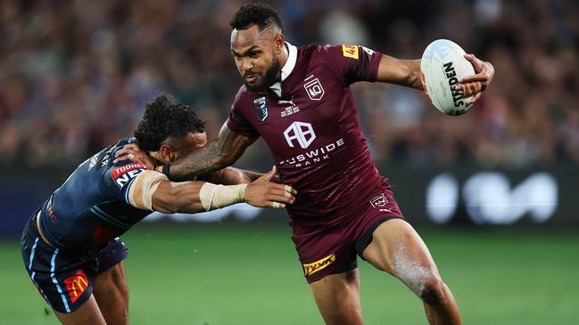 ADELAIDE, AUSTRALIA - MAY 31:  Hamiso Tabuai-Fidow of the Maroons beats the tackle of Josh Addo-Carr of the Blues before scoring a try during game one of the 2023 State of Origin series between the Queensland Maroons and New South Wales Blues at Adelaide Oval on May 31, 2023 in Adelaide, Australia. (Photo by Mark Kolbe/Getty Images)