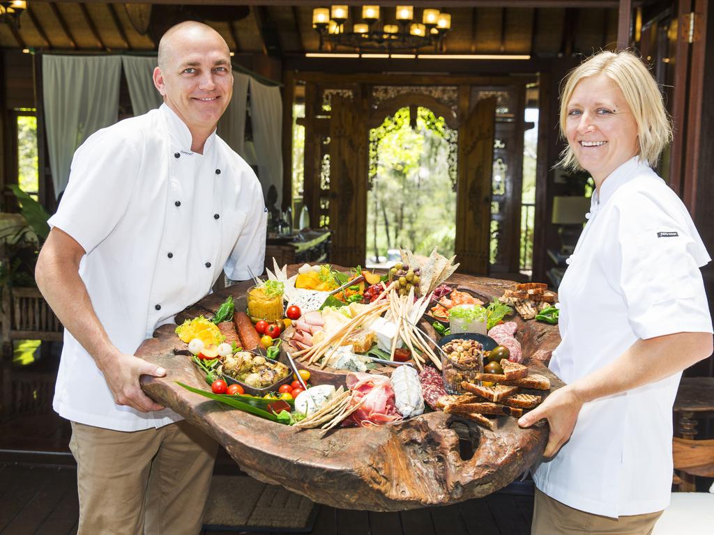 Chefs Ben Holloway and Lisa Mahar hold the welcome platter that greets guests on arrival at a rejuvenated Makepeace Island. Picture: Lachie Millard