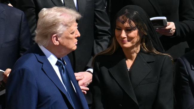 US President Donald Trump (L) and First Lady Melania Trump stand alongside leaders as they attend the late Pope Francis' funeral ceremony at St Peter's Square at the Vatican on April 26, 2025. (Photo by Mandel NGAN / AFP)