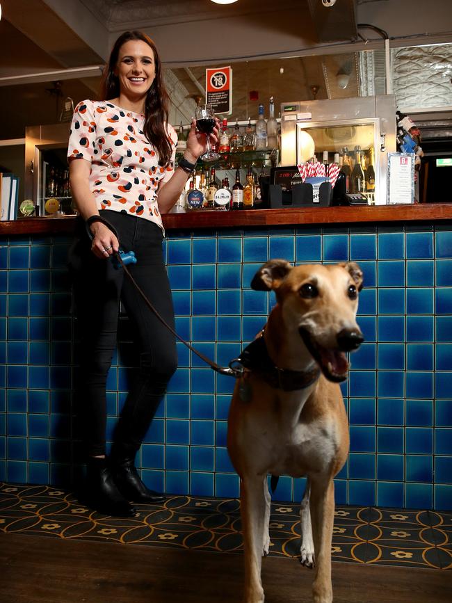 Kat Mayhook and her greyhound Mya enjoying an evening tipple at The Balmain Hotel. Picture: Toby Zerna