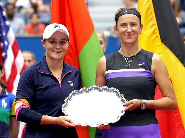 NEW YORK, NEW YORK - SEPTEMBER 08:  Victoria Azarenka of Belarus (R) and Ashleigh Barty of Australia pose with the runner-up trophy following their defeat in the Women's Double's final match against Elise Mertens of Belgium and Aryna Sabalenka of Belarus on day fourteen of the 2019 US Open at the USTA Billie Jean King National Tennis Center on September 08, 2019 in the Queens borough of New York City. (Photo by Al Bello/Getty Images)