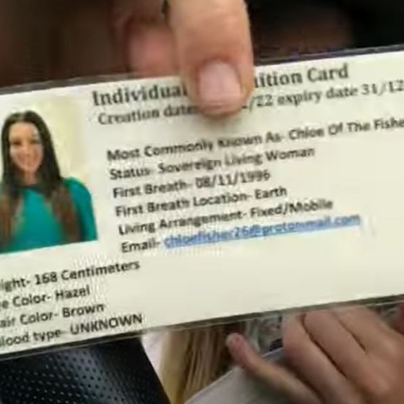 Ms Fisher’s homemade, laminated ID card lists her birthplace as “First Breath Location - Earth” and her blood type as “unknown”. Picture: YouTube