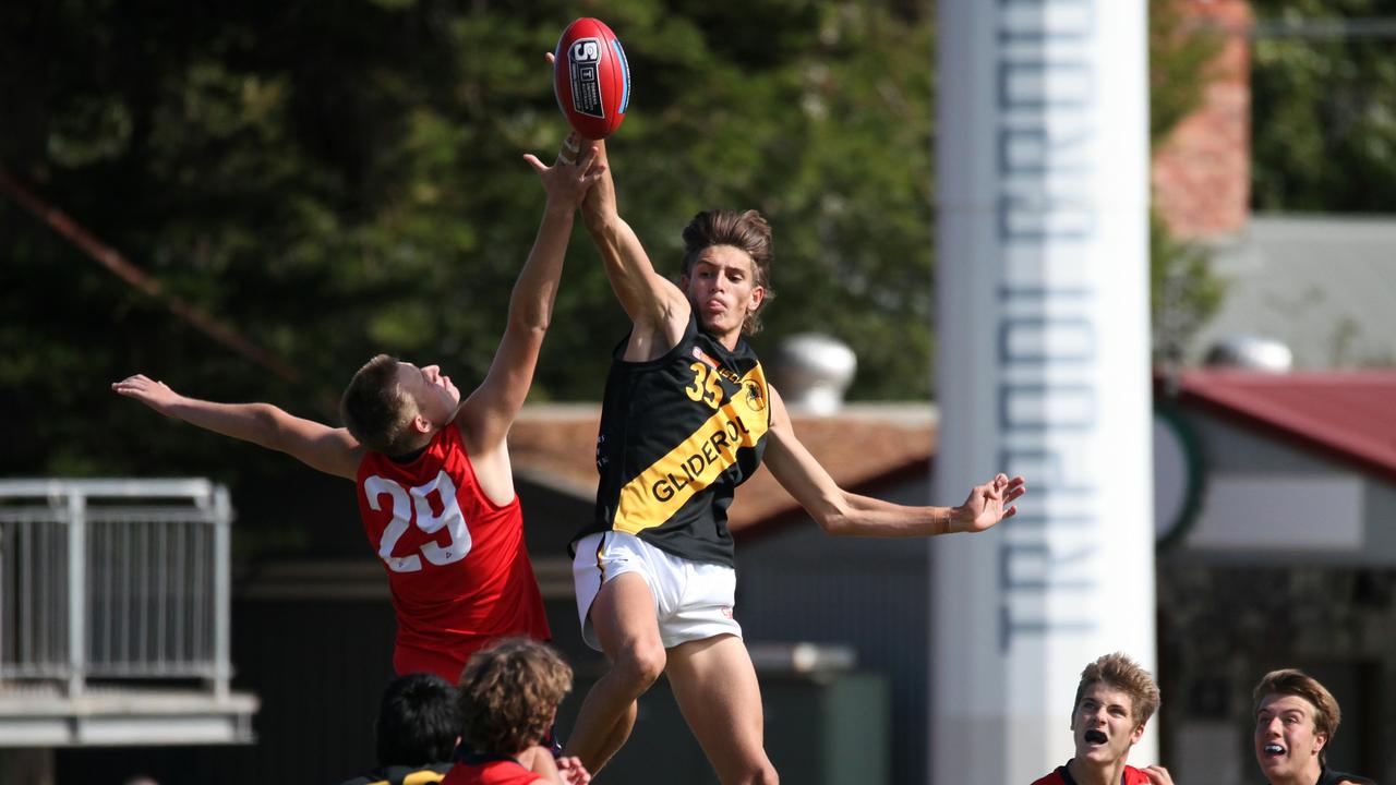 Glenelg under-16 player Harry Francis wins the ruck tap. Picture: Peter Argent