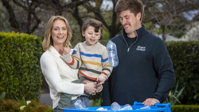 Kelsey Raphael with her son Nico, 4, and Harry DeRuiter from Direct Collect, a new company offering Uber-style bottle collection. Picture: Emma Brasier