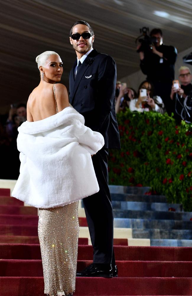 Once up the stairs, Kim soon changed into an exact replica of the valuable dress. Picture: Angela Weiss/AFP