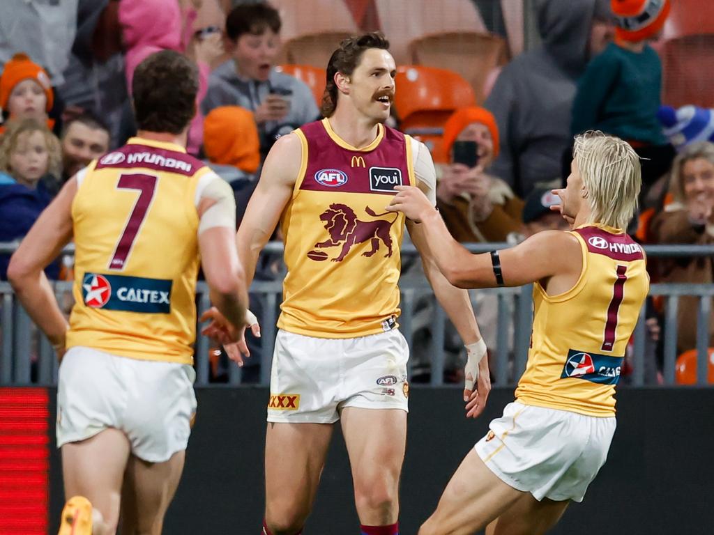 Kai Lohmann and Jarrod Berry get to Daniher after one of his last-quarter goals. Picture: Dylan Burns/AFL Photos via Getty Images