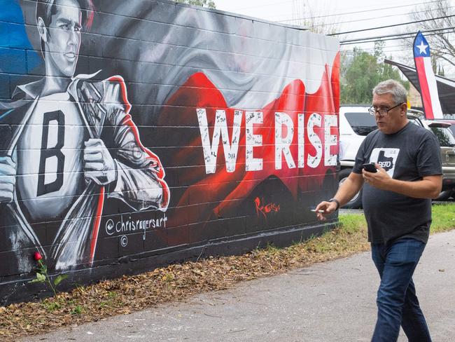 A pedestrian passes the new mural of Democratic US Senate candidate Beto O'Rourke in Austin, Texas. Picture: AFP