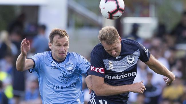 Alex Wilkinson tries to come to terms with Ola Toivonen. Picture: AAP.