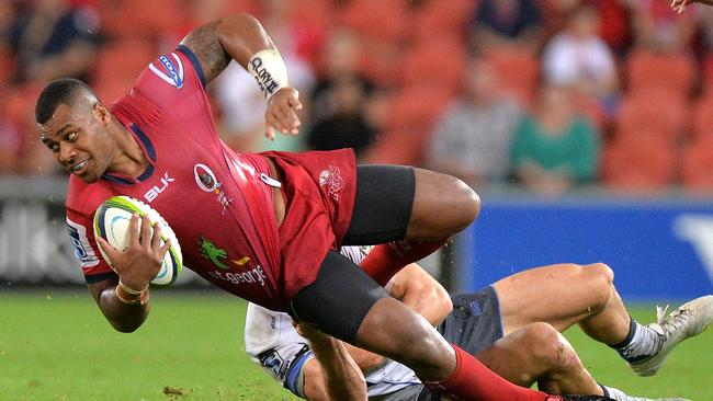 BRISBANE, AUSTRALIA - FEBRUARY 21: Samu Kerevi of the Reds is tackled.