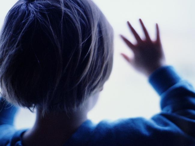 Generic image silhouette of young child with hands pressed against window. (Getty Images)